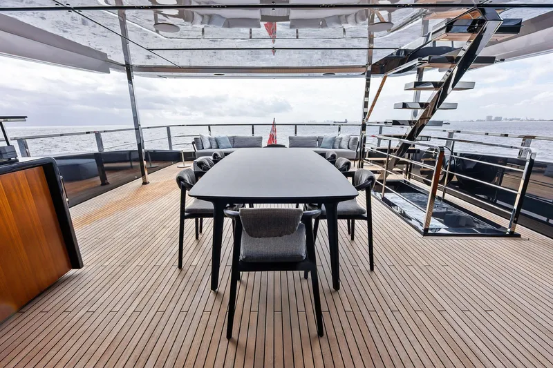Slide: The Image of Luxurious deck of 2024 Riva 130' Bellissima yacht with elegant dining area. - 14