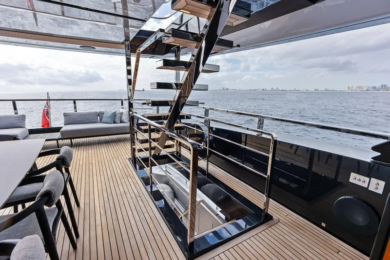 Slide: The Image of Luxurious 2024 Riva 130' Bellissima yacht deck with modern seating and ocean view. - 15