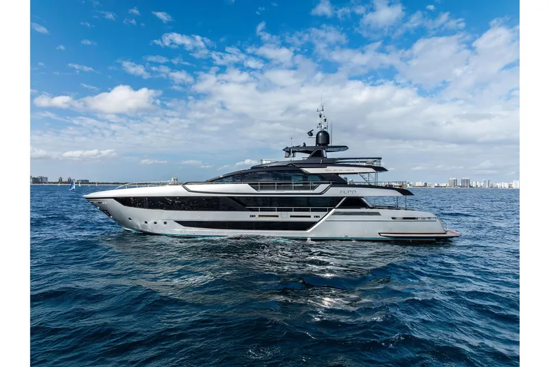 Slide: The Image of Luxurious 2024 Riva 130' Bellissima yacht cruising on open water under a blue sky. - 2