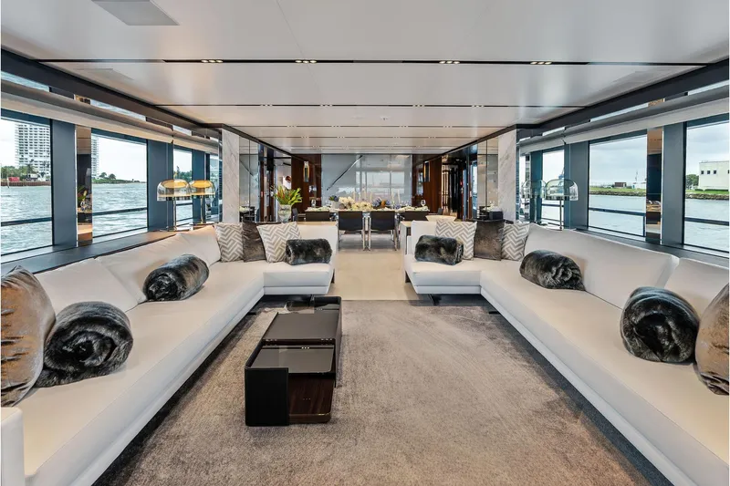 Slide: The Image of Luxurious interior of 2024 Riva 130' Bellissima yacht with elegant seating and panoramic windows. - 22