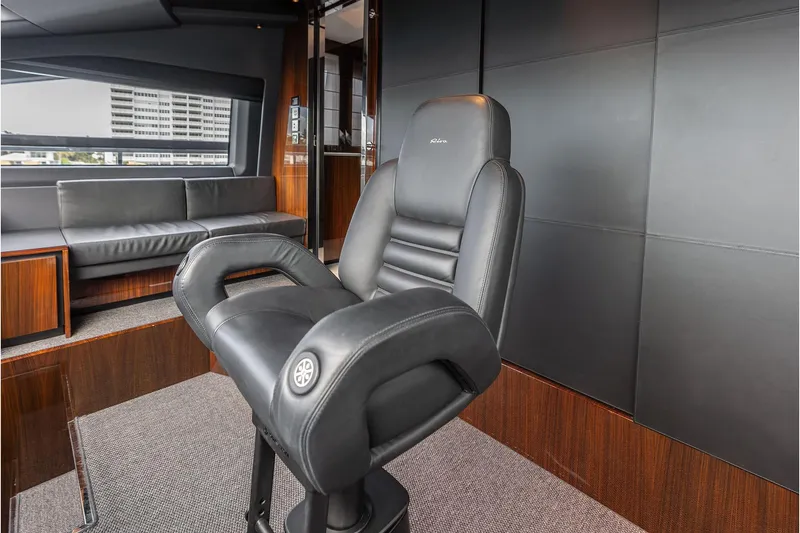 Slide: The Image of Luxurious interior of 2024 Riva 130' Bellissima yacht with sleek black seating. - 28