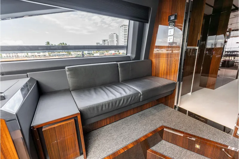 Slide: The Image of Luxurious interior of 2024 Riva 130' Bellissima yacht with sleek seating and wood accents. - 29