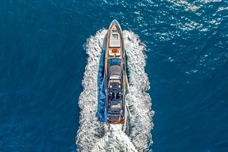 Slide: The Image of Aerial view of 2024 Riva 130' Bellissima yacht cruising on blue ocean waters. - 1