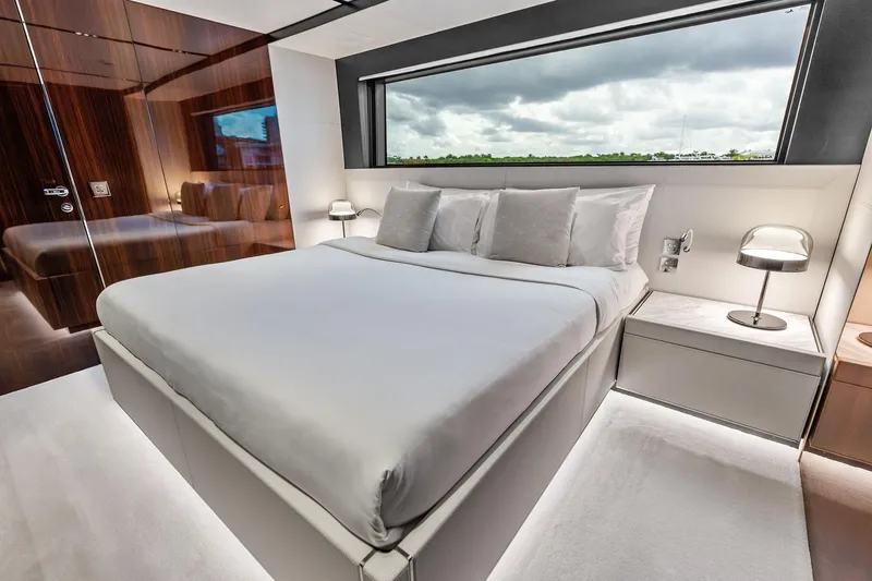 Slide: The Image of Luxurious bedroom interior of 2024 Riva 130' Bellissima yacht with modern design and large window. - 43