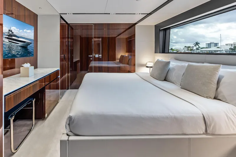 Slide: The Image of Luxurious bedroom interior of 2024 Riva 130' Bellissima yacht with elegant wood finishes. - 44