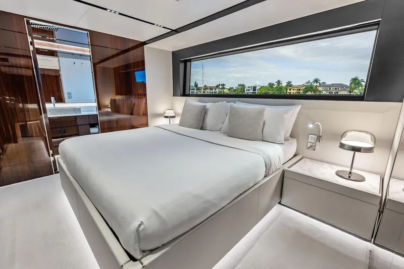 Slide: The Image of Luxurious bedroom interior of 2024 Riva 130' Bellissima yacht with modern design and large window view. - 47