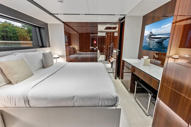 Slide: The Image of Luxurious bedroom interior of 2024 Riva 130' Bellissima yacht with elegant wood finishes. - 48
