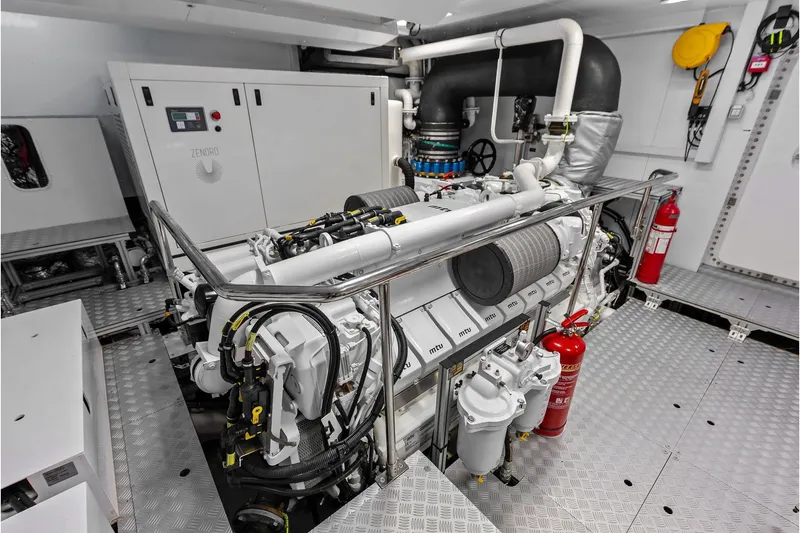 Slide: The Image of Engine room of 2024 Riva 130' Bellissima yacht, featuring advanced machinery and safety equipment. - 63