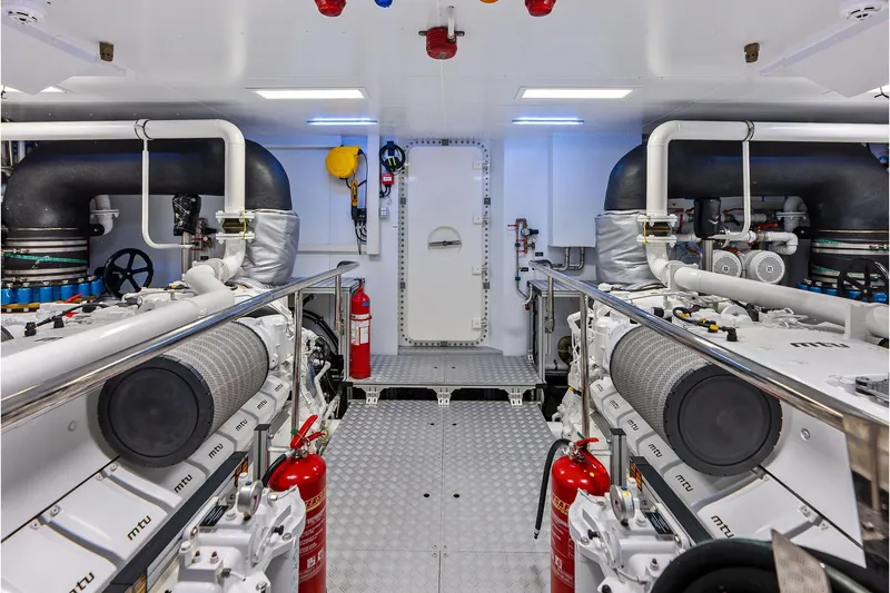 Slide: The Image of Engine room of 2024 Riva 130' Bellissima yacht, featuring advanced machinery and safety equipment. - 64