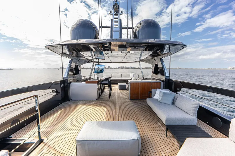 Slide: The Image of Luxurious 2024 Riva 130' Bellissima yacht deck with modern seating and ocean view. - 9