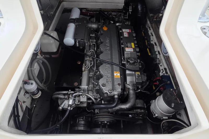 Slide: The Image of Engine compartment of a 2005 SeaVee 310i Open boat, showcasing detailed machinery. - 10