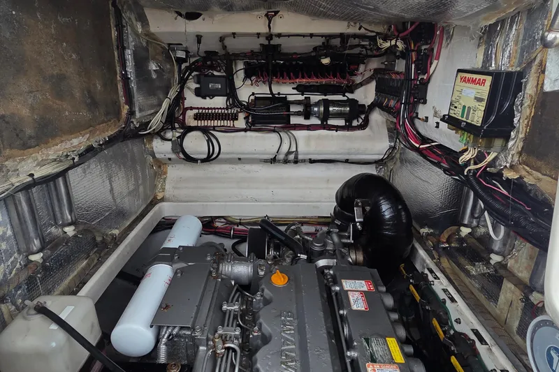 Slide: The Image of Engine compartment of 2005 SeaVee 310i Open boat with Yanmar engine and wiring. - 11