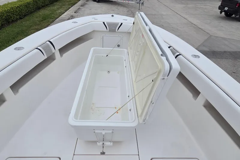 Slide: The Image of 2005 SeaVee 310i Open boat with open storage compartment on deck. - 16