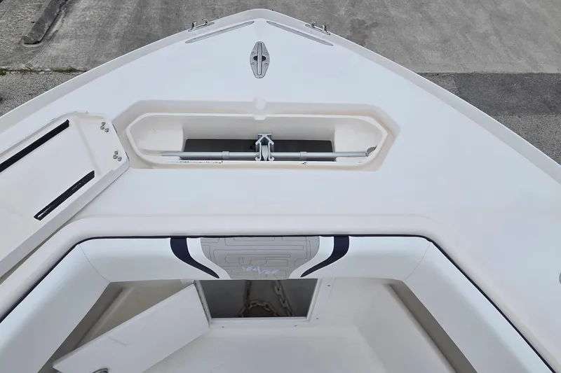 Slide: The Image of 2005 SeaVee 310i Open boat deck with storage compartments and anchor locker. - 17
