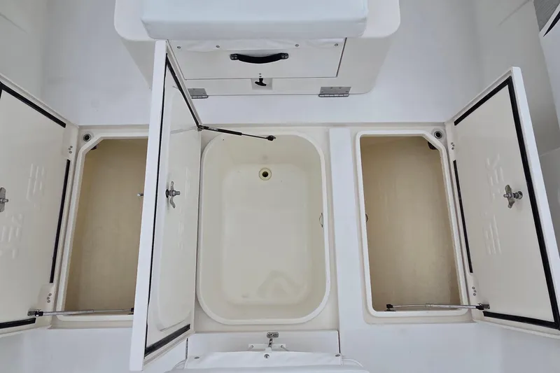 Slide: The Image of 2005 SeaVee 310i Open boat storage compartments with open hatches. - 20