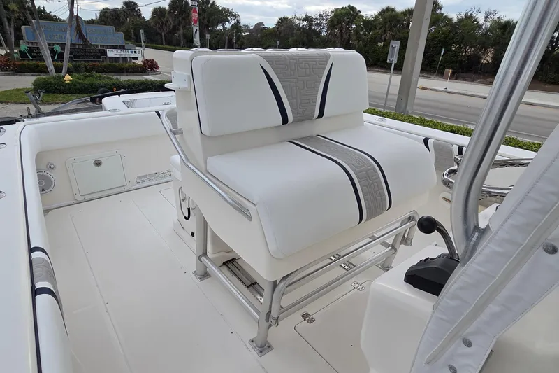 Slide: The Image of 2005 SeaVee 310i Open boat interior with cushioned seating and stainless steel railings. - 24