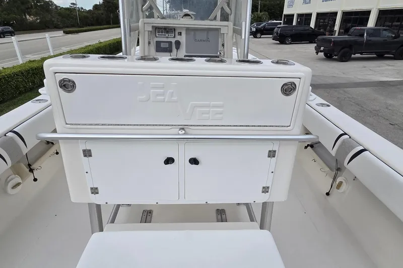 Slide: The Image of 2005 SeaVee 310i Open boat console with storage and Garmin electronics. - 25