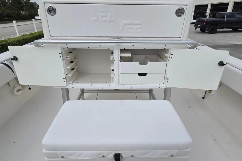 Slide: The Image of 2005 SeaVee 310i Open boat storage compartments with open doors and seating. - 26