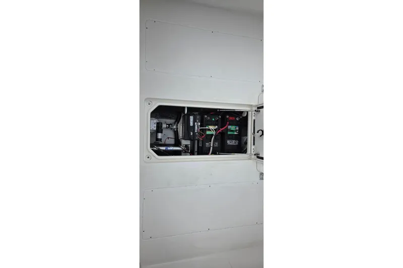 Slide: The Image of Electrical compartment of 2005 SeaVee 310i Open boat, showing battery and wiring. - 28