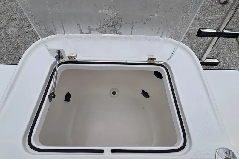 Slide: The Image of Open storage compartment on 2005 SeaVee 310i Open boat. - 34