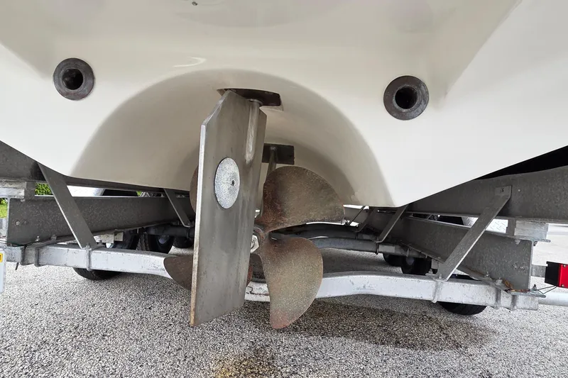 Slide: The Image of 2005 SeaVee 310i Open boat propeller and rudder on trailer. - 42