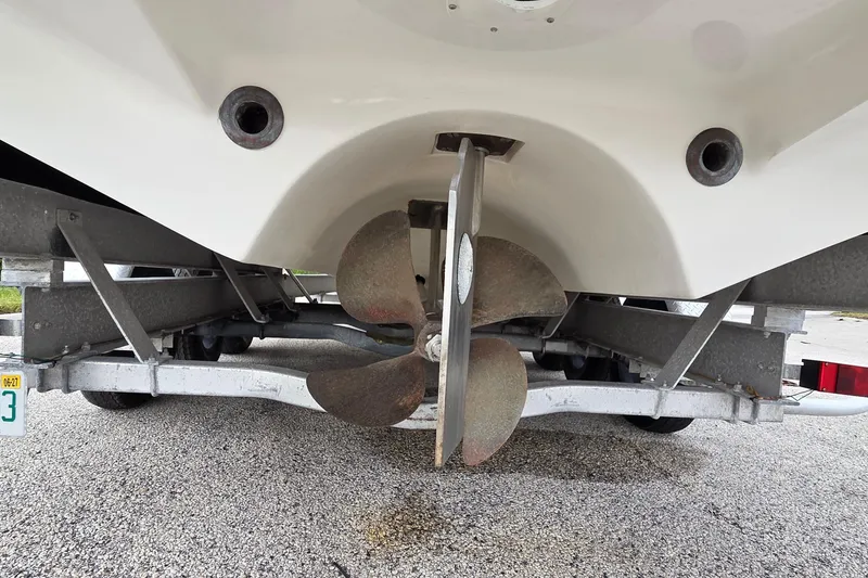 Slide: The Image of 2005 SeaVee 310i Open boat propeller on trailer, close-up view. - 43