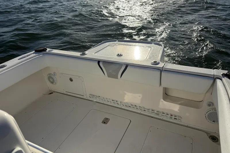 Slide: The Image of 2005 SeaVee 310i Open boat deck with ocean view, showcasing spacious design. - 47