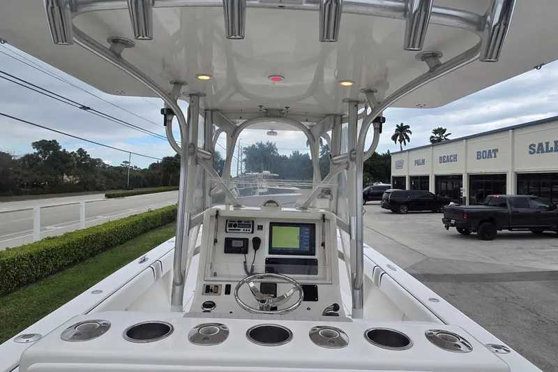 Slide: The Image of 2005 SeaVee 310i Open boat dashboard with navigation system, parked near dealership. - 5