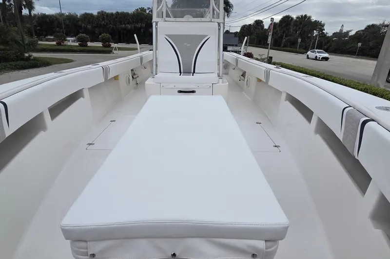 Slide: The Image of 2005 SeaVee 310i Open boat interior with white seating and spacious deck. - 8