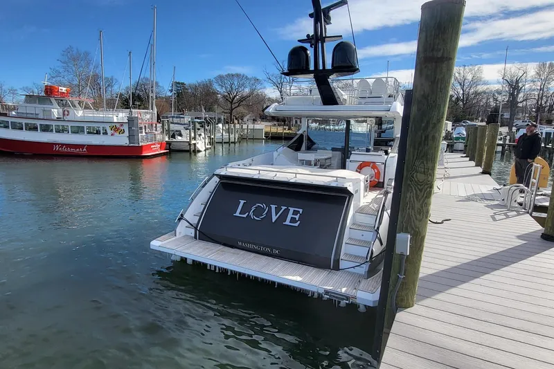 Slide: The Image of 2023 Azimut S7 yacht docked, featuring "LOVE" on the stern, Washington D.C. registration. - 15