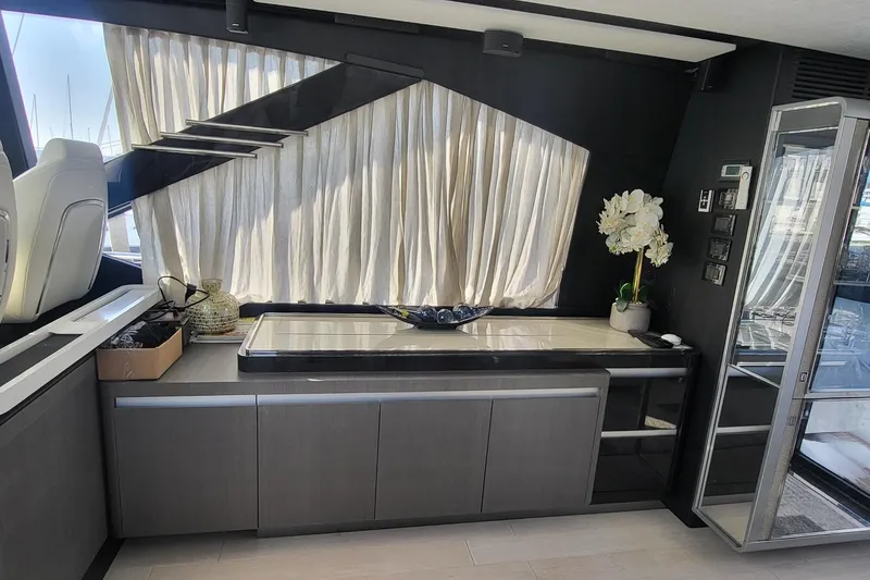 Slide: The Image of Luxurious interior of 2023 Azimut S7 yacht with modern cabinetry and elegant decor. - 18