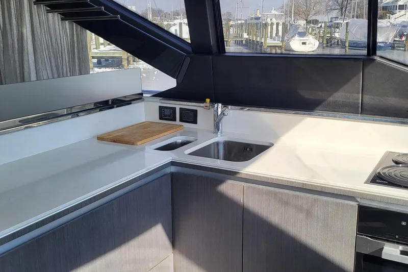 Slide: The Image of Modern kitchen interior of 2023 Azimut S7 yacht with sleek countertops and appliances. - 21