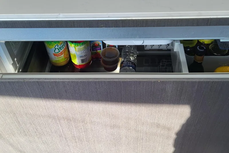 Slide: The Image of Refrigerator on 2023 Azimut S7 yacht with beverages and condiments. - 22