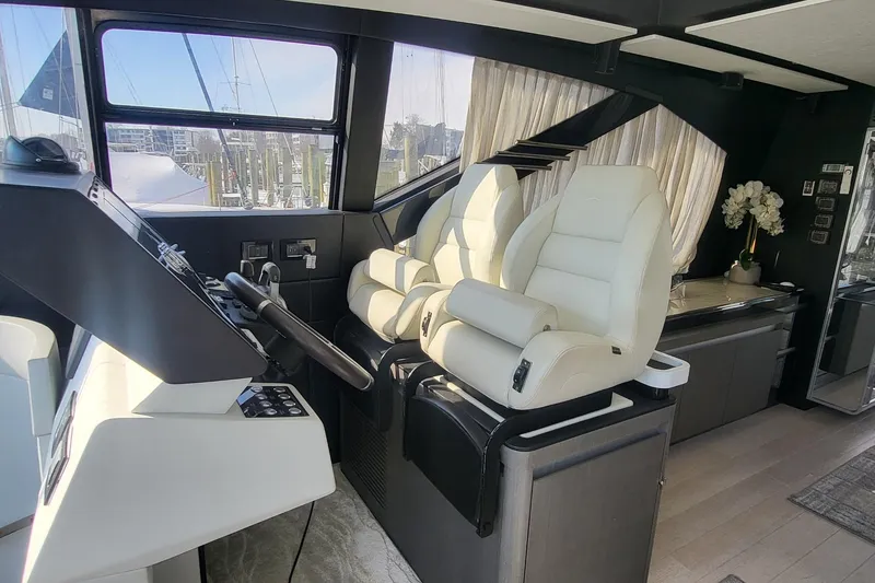 Slide: The Image of Luxurious interior of 2023 Azimut S7 yacht with modern helm and plush seating. - 23