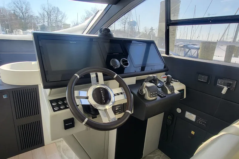 Slide: The Image of 2023 Azimut S7 yacht helm with modern controls and dual touchscreens. - 24