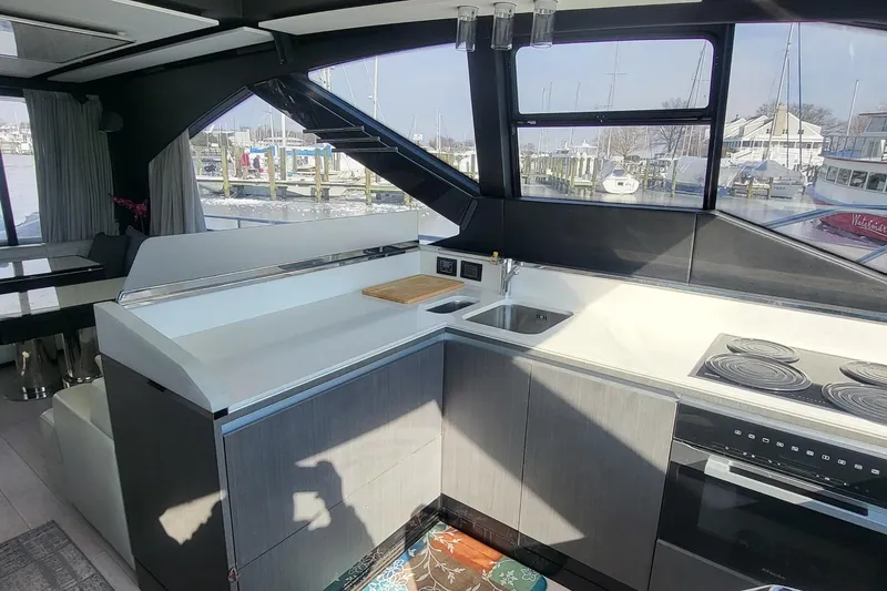 Slide: The Image of Modern kitchen interior of 2023 Azimut S7 yacht with sleek design and marina view. - 27