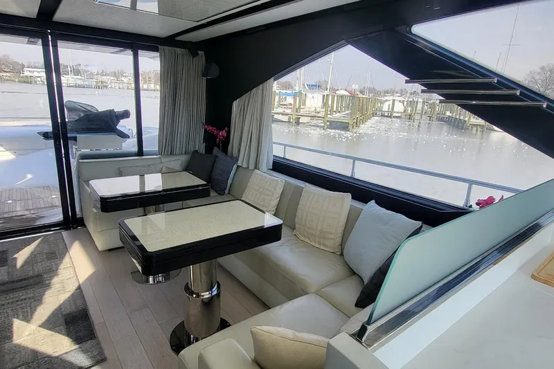 Slide: The Image of Luxurious interior of 2023 Azimut S7 yacht with elegant seating and waterfront view. - 28