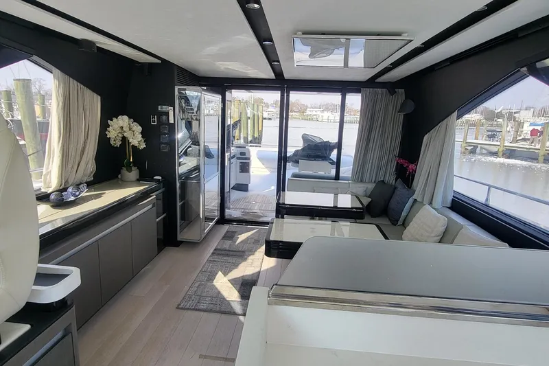 Slide: The Image of Luxurious interior of 2023 Azimut S7 yacht with modern furnishings and waterfront view. - 30