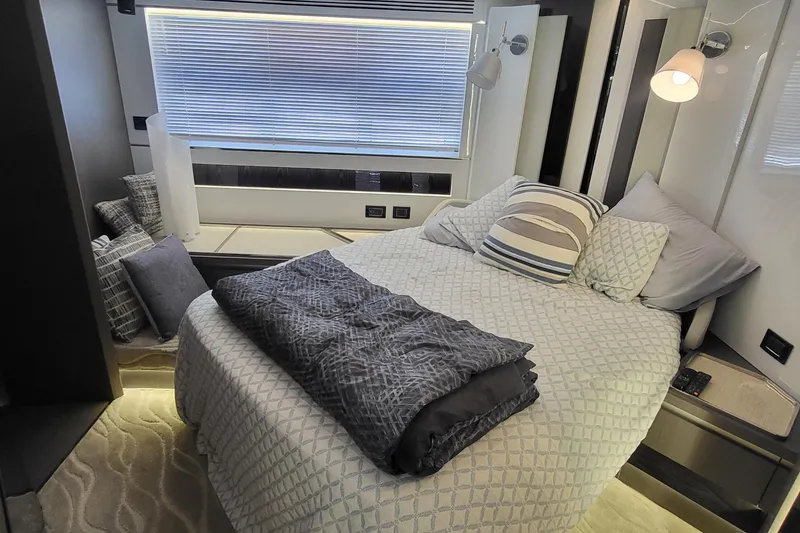Slide: The Image of Luxurious bedroom interior of 2023 Azimut S7 yacht with modern decor and cozy bedding. - 31