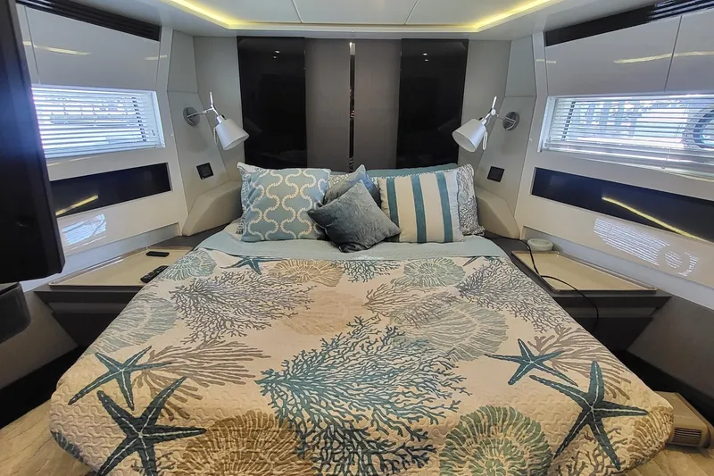 Slide: The Image of Luxurious 2023 Azimut S7 yacht bedroom with ocean-themed bedding and modern decor. - 37