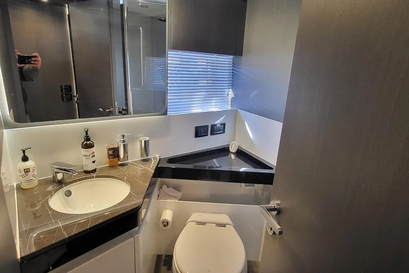 Slide: The Image of Luxurious bathroom in 2023 Azimut S7 yacht with modern fixtures and elegant design. - 38