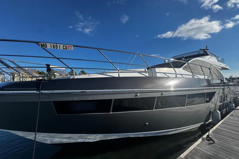 Slide: The Image of 2023 Azimut S7 luxury yacht docked under clear blue sky. - 4