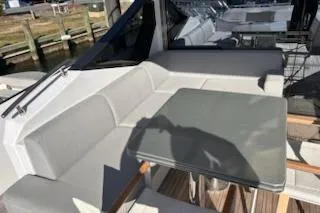 Slide: The Image of 2023 Azimut S7 yacht with sleek seating and modern table on deck. - 40
