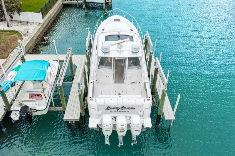 Slide: The Image of Aerial view of 2019 Intrepid 410 Evolution yacht docked in turquoise water. - 14
