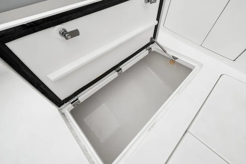 Slide: The Image of Open storage compartment on 2019 Intrepid 410 Evolution boat deck. - 35