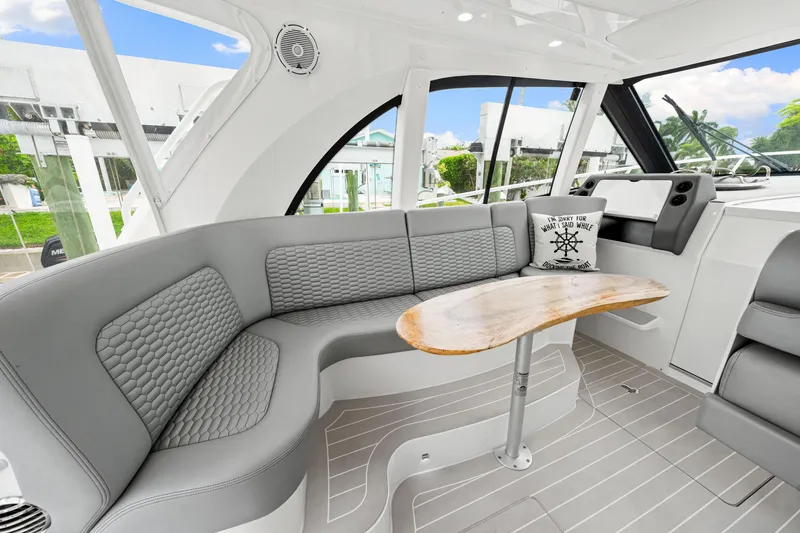 Slide: The Image of Luxurious interior of 2019 Intrepid 410 Evolution yacht with elegant seating and wooden table. - 44
