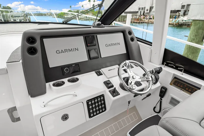 Slide: The Image of 2019 Intrepid 410 Evolution helm with Garmin displays and modern steering wheel. - 49