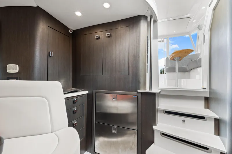 Slide: The Image of Interior of 2019 Intrepid 410 Evolution yacht with modern design and sleek cabinetry. - 57