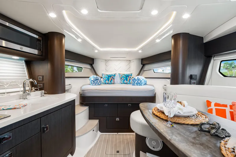 Slide: The Image of Luxurious interior of 2019 Intrepid 410 Evolution yacht with modern kitchen and cozy sleeping area. - 60