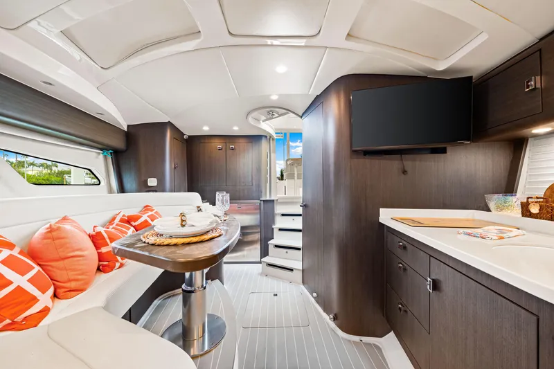 Slide: The Image of Luxurious interior of 2019 Intrepid 410 Evolution yacht with modern design and vibrant accents. - 61